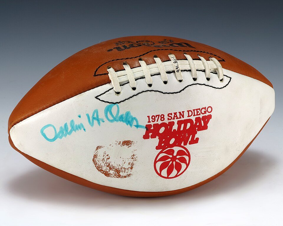 A football with a signature and the words 1978 San Diego Holiday Bowl.