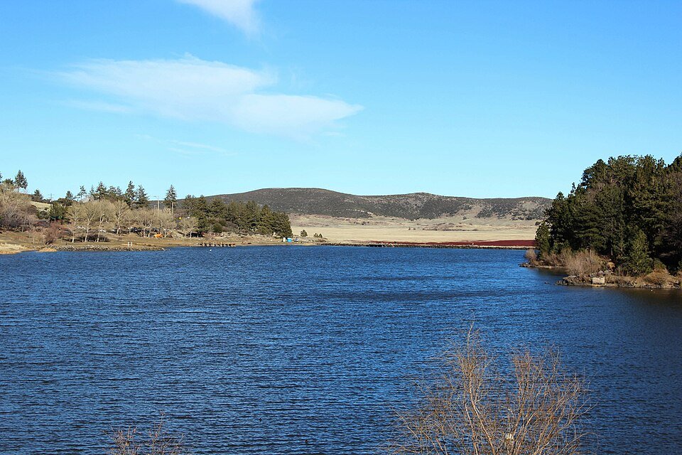 Blue Lake Cuyamaca with grassy hills and pines on the far shore
