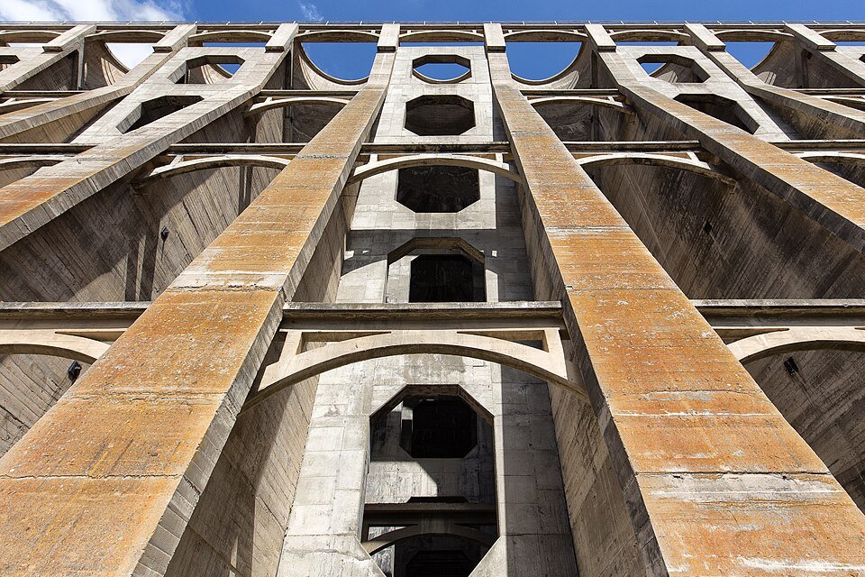 The tall concrete arches of the Lake Hodges Dam seen from below