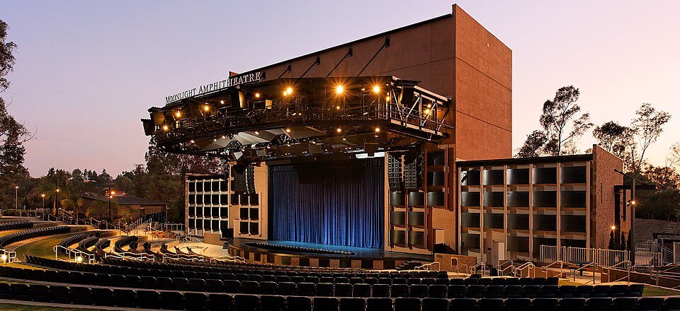 The Moonlight Amphitheatre stage and rust-colored tower at dusk