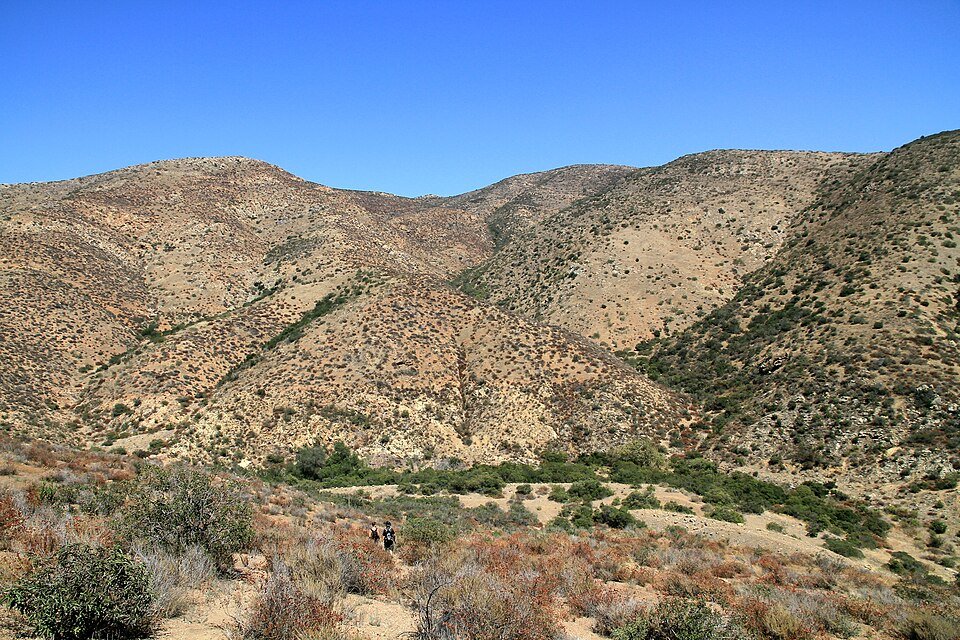 Dry brown hills under a deep blue sky near Otay Lake