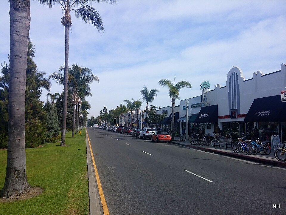 Orange Avenue in Coronado, a wide street lined with palm trees and shops