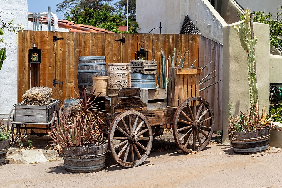 A wooden wagon with barrels and cactus in Old Town San Diego State Historic Park