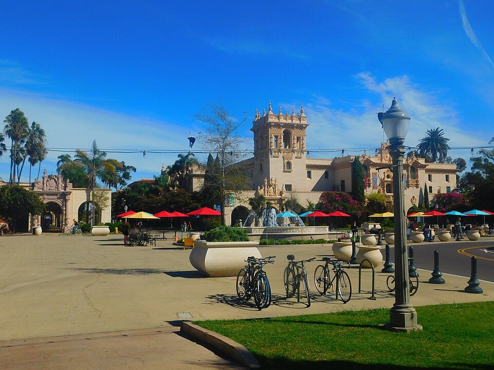 Plaza de Panama in Balboa Park with colorful umbrellas, bicycles and Spanish-style buildings